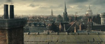 Movie still from “Oliver Twist” (2005), directed by Roman Polanski – A view of a city from the roof of an old building; Extreme Wide shot, Low angle