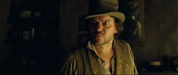 Movie still from “Oliver Twist” (2005), directed by Roman Polanski – A person wearing a hat; Close Up shot, Low angle