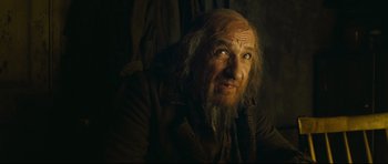 Movie still from “Oliver Twist” (2005), directed by Roman Polanski – An old man with long hair and a long beard; Close Up shot, Low angle