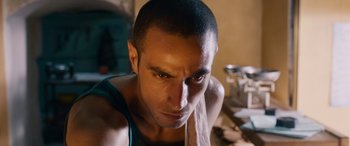 Movie still from “Omar” (2013), directed by Hany Abu-Assad – A person with a towel around his neck; Close Up shot, Low angle
