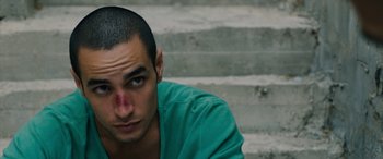 Movie still from “Omar” (2013), directed by Hany Abu-Assad – A man with a bandage on his face; Close Up shot, High angle