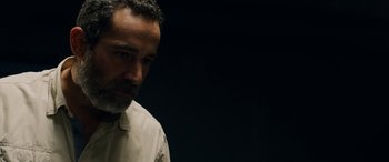 Movie still from “Omar” (2013), directed by Hany Abu-Assad – A person wearing a white shirt; Close Up shot, Low angle