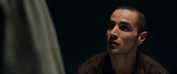 Movie still from “Omar” (2013), directed by Hany Abu-Assad – A person sitting in front of a mirror; Close Up shot, Over the shoulder angle