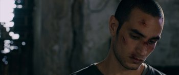 Movie still from “Omar” (2013), directed by Hany Abu-Assad – A man's face and ear; Close Up shot, Over the shoulder angle