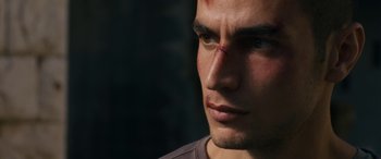Movie still from “Omar” (2013), directed by Hany Abu-Assad – A person with a bandage on his face; Extreme Close Up shot, Low angle