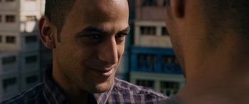Movie still from “Omar” (2013), directed by Hany Abu-Assad – A man's face as he looks into the camera; Close Up shot, Over the shoulder angle