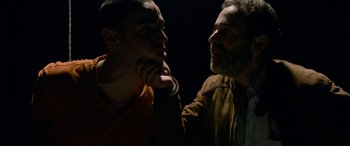 Movie still from “Omar” (2013), directed by Hany Abu-Assad – A man and a man standing next to each other; Close Up shot, Over the shoulder angle