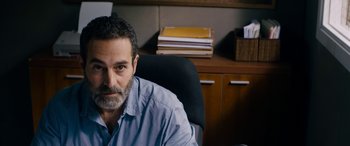 Movie still from “Omar” (2013), directed by Hany Abu-Assad – A person sitting at a desk; Close Up shot, Over the shoulder angle