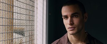 Movie still from “Omar” (2013), directed by Hany Abu-Assad – A person wearing a brown shirt; Close Up shot, Over the shoulder angle