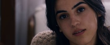 Movie still from “Omar” (2013), directed by Hany Abu-Assad – A woman's face with brown eyes; Close Up shot, Over the shoulder angle