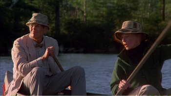 Movie still from “On Golden Pond” (1981), directed by Mark Rydell – Two people are sitting in a boat on the water; Medium shot, Over the shoulder angle