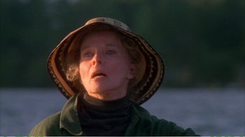 Movie still from “On Golden Pond” (1981), directed by Mark Rydell – An older woman wearing a hat looking up at the sky; Close Up shot, Low angle