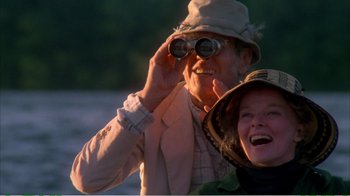 Movie still from “On Golden Pond” (1981), directed by Mark Rydell – An older man and woman looking through binoculars; Medium shot, Low angle
