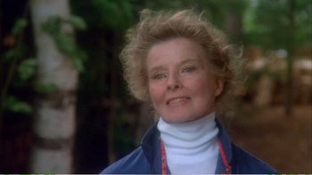 Movie still from “On Golden Pond” (1981), directed by Mark Rydell – An older woman wearing a white sweater and a blue jacket; Close Up shot, Low angle