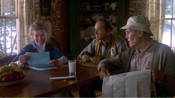 Movie still from “On Golden Pond” (1981), directed by Mark Rydell – A group of people sitting around a table; Medium shot, Over the shoulder angle