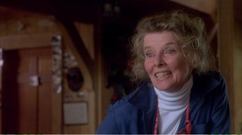 Movie still from “On Golden Pond” (1981), directed by Mark Rydell – An older woman smiling for the camera in a room; Close Up shot, Low angle