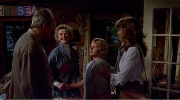 Movie still from “On Golden Pond” (1981), directed by Mark Rydell – A group of people standing next to each other in a room; Medium shot, Over the shoulder angle