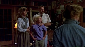 Movie still from “On Golden Pond” (1981), directed by Mark Rydell – A man and a woman standing next to a child; Medium shot, Over the shoulder angle