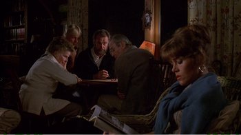 Movie still from “On Golden Pond” (1981), directed by Mark Rydell – A group of people sitting around a table; Medium shot, High angle