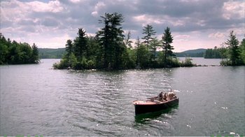 Movie still from “On Golden Pond” (1981), directed by Mark Rydell – A small boat in the middle of a lake; Extreme Wide shot, High angle