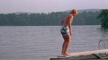 Movie still from “On Golden Pond” (1981), directed by Mark Rydell – A man standing on a board in the middle of a lake; Wide shot, High angle