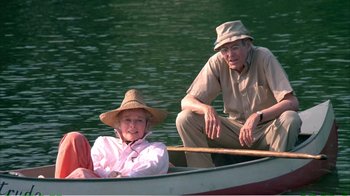 Movie still from “On Golden Pond” (1981), directed by Mark Rydell – An older man and woman in a boat on the water; Medium shot, High angle