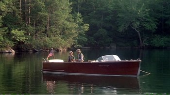 Movie still from “On Golden Pond” (1981), directed by Mark Rydell – Two men are in a boat on the water; Extreme Wide shot, High angle