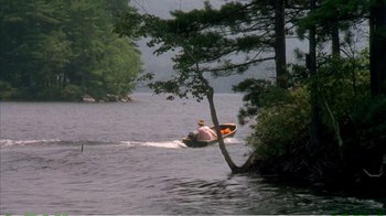 Movie still from “On Golden Pond” (1981), directed by Mark Rydell – A person on a boat in the middle of a lake; Extreme Wide shot, High angle