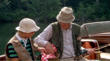 Movie still from “On Golden Pond” (1981), directed by Mark Rydell – A man and a woman on a boat in the water; Medium shot, High angle
