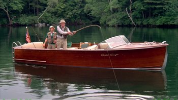 Movie still from “On Golden Pond” (1981), directed by Mark Rydell – A man and a woman fishing on a boat; Wide shot, High angle