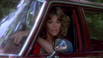 Movie still from “On Golden Pond” (1981), directed by Mark Rydell – A woman sitting in the driver's seat of a red car; Close Up shot, Over the shoulder angle
