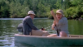 Movie still from “On Golden Pond” (1981), directed by Mark Rydell – A man and a woman are in a boat on the water; Wide shot, Over the shoulder angle