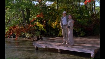 Movie still from “On Golden Pond” (1981), directed by Mark Rydell – A man and a woman standing on a dock; Wide shot, High angle