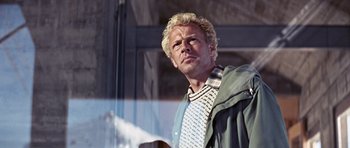 Movie still from “On Her Majesty's Secret Service” (1969), directed by Peter R. Hunt – A person wearing a jacket and a tie; Close Up shot, Low angle