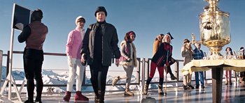 Movie still from “On Her Majesty's Secret Service” (1969), directed by Peter R. Hunt – A group of people standing next to a railing; Wide shot, Low angle