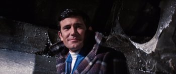 Movie still from “On Her Majesty's Secret Service” (1969), directed by Peter R. Hunt – A person wearing a jacket; Close Up shot, Low angle