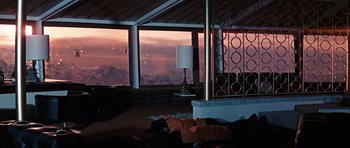 Movie still from “On Her Majesty's Secret Service” (1969), directed by Peter R. Hunt – A room with a view of a mountain range; Wide shot, Low angle