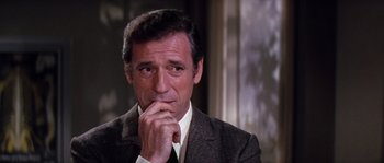 Movie still from “On a Clear Day You Can See Forever” (1970), directed by Vincente Minnelli – A person wearing a suit and tie; Close Up shot, Over the shoulder angle
