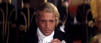 Movie still from “On a Clear Day You Can See Forever” (1970), directed by Vincente Minnelli – A person wearing a suit and tie; Close Up shot, Over the shoulder angle