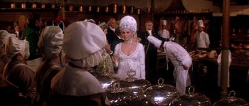 Movie still from “On a Clear Day You Can See Forever” (1970), directed by Vincente Minnelli – A group of people standing in a room; Medium shot, Over the shoulder angle