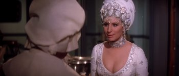 Movie still from “On a Clear Day You Can See Forever” (1970), directed by Vincente Minnelli – A woman in a white dress and a white head piece; Close Up shot, Over the shoulder angle
