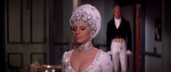 Movie still from “On a Clear Day You Can See Forever” (1970), directed by Vincente Minnelli – A woman in a white dress and a head piece; Medium shot, Over the shoulder angle