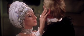 Movie still from “On a Clear Day You Can See Forever” (1970), directed by Vincente Minnelli – A man and a woman are looking into each others eyes; Close Up shot, Over the shoulder angle