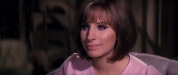 Movie still from “On a Clear Day You Can See Forever” (1970), directed by Vincente Minnelli – A person wearing a pink shirt; Close Up shot, Over the shoulder angle