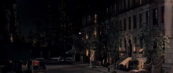 Movie still from “On a Clear Day You Can See Forever” (1970), directed by Vincente Minnelli – A city street at night lit up by street lights; Extreme Wide shot, High angle