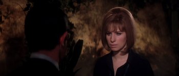 Movie still from “On a Clear Day You Can See Forever” (1970), directed by Vincente Minnelli – A man and a woman are standing next to each other; Close Up shot, Over the shoulder angle