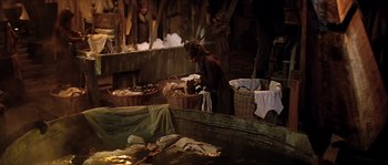 Movie still from “On a Clear Day You Can See Forever” (1970), directed by Vincente Minnelli – A dog standing next to baskets of food; Wide shot, High angle