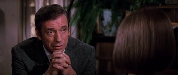 Movie still from “On a Clear Day You Can See Forever” (1970), directed by Vincente Minnelli – A person sitting with his hands clasped together; Close Up shot, Over the shoulder angle