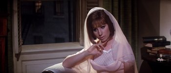 Movie still from “On a Clear Day You Can See Forever” (1970), directed by Vincente Minnelli – A woman in a white veil sitting on a chair; Close Up shot, High angle