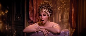 Movie still from “On a Clear Day You Can See Forever” (1970), directed by Vincente Minnelli – A person with curly hair wearing a tiara; Close Up shot, High angle